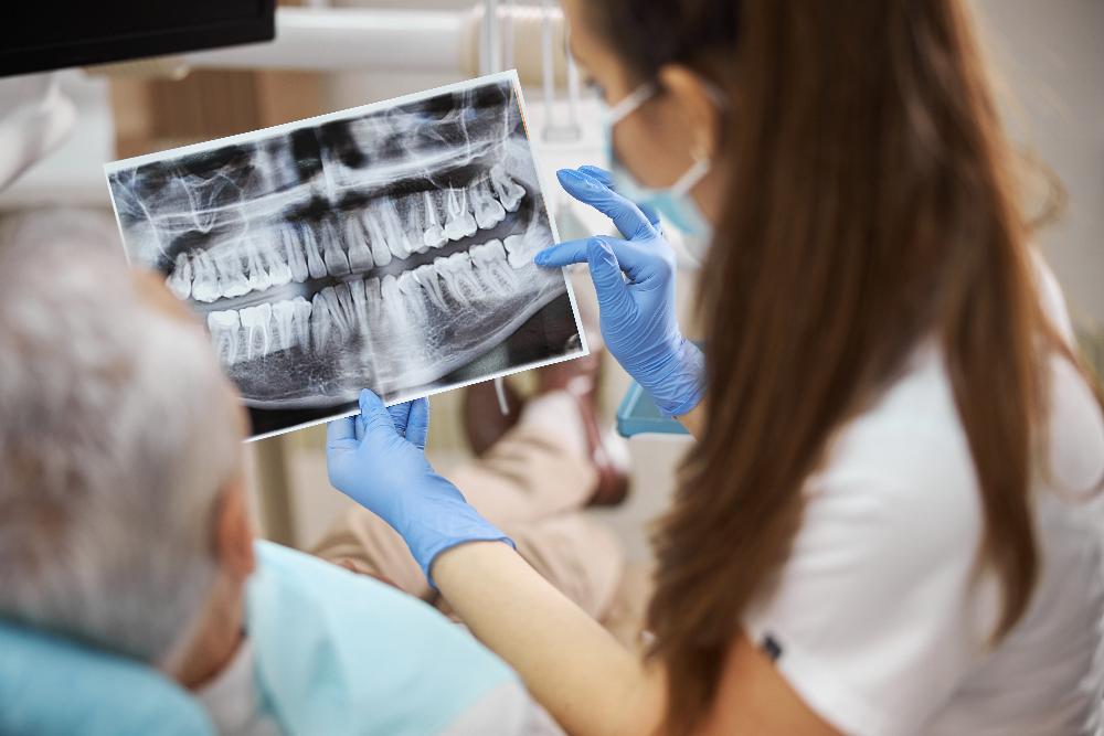 dentist explaining dental x-rays to a patient in knoxville