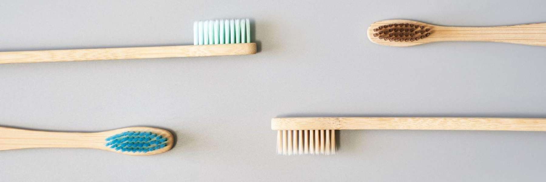Four wooden toothbrushes