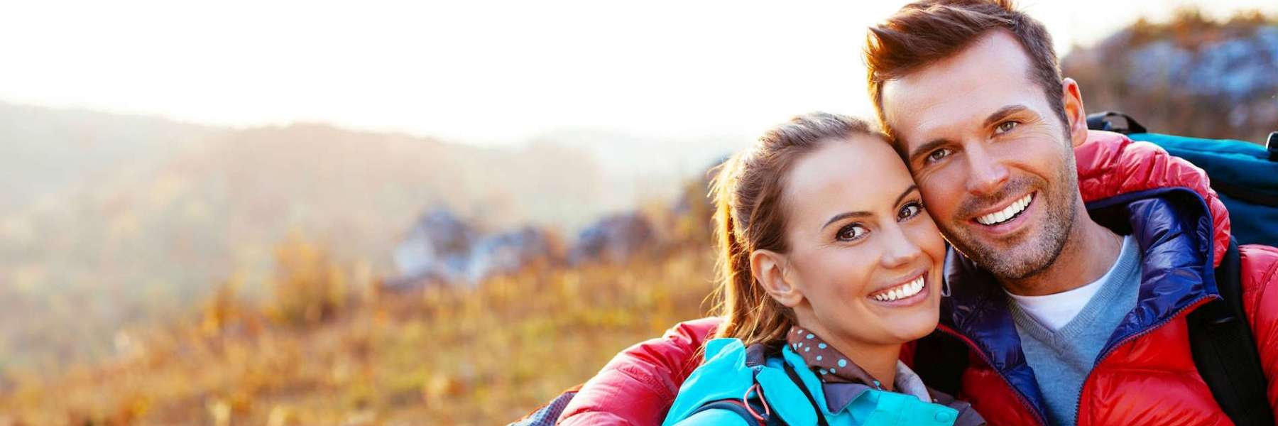 A couple smiling after getting teeth whitening treatment in Knoxville, TN