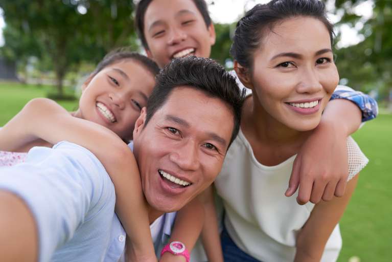 smiling family at the park in knoxville